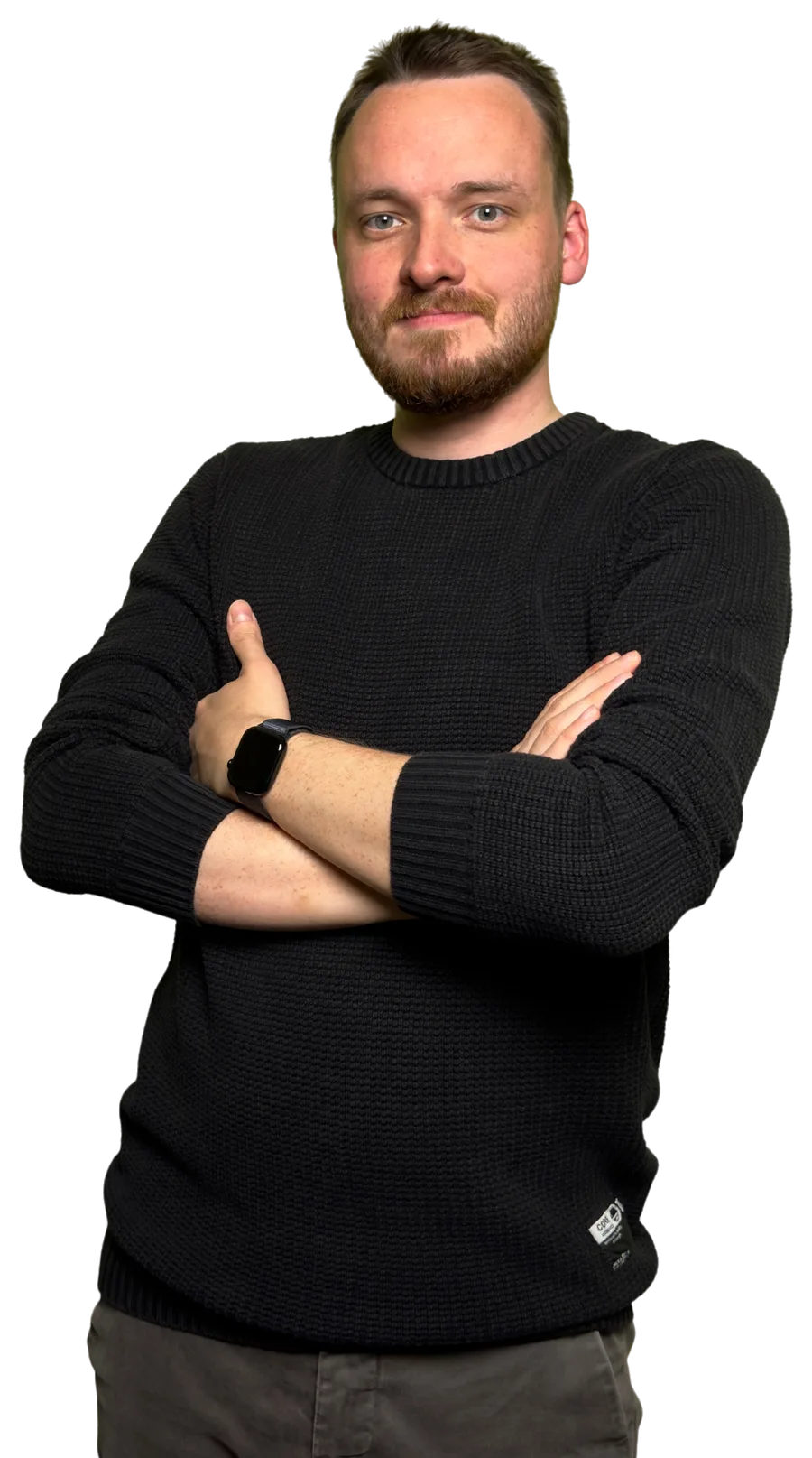 Anthony, your teacher, smiling with his arms folded
